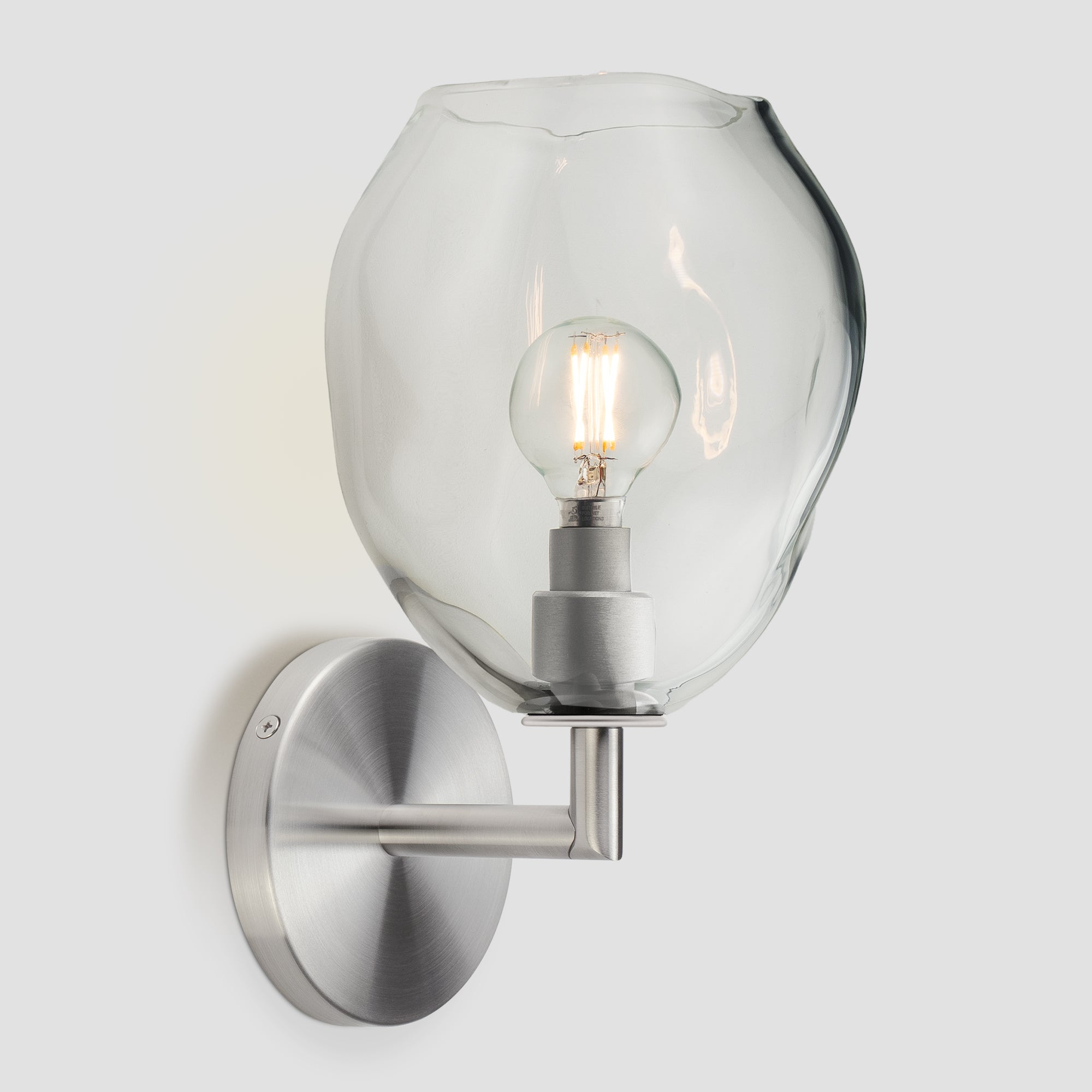 Wabi Sconce Clear Glass Satin Nickel Metal Round Canopy